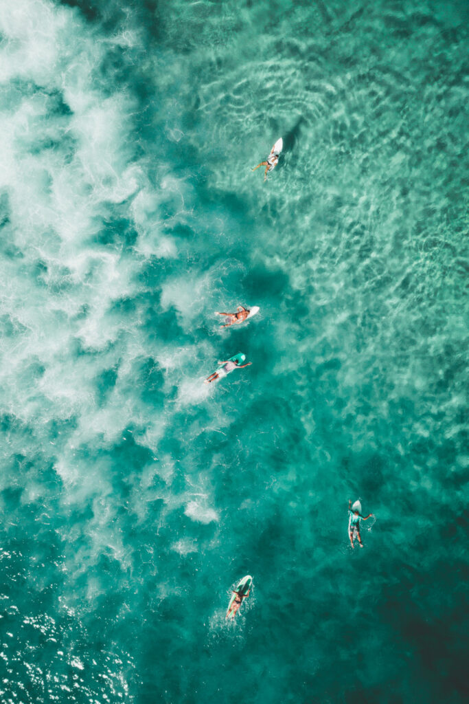 Reef Instagram post with aerial surfers in turquoise water