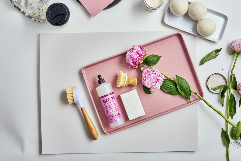 Meyer's Clean Day dish soap with peonies on a pink tray